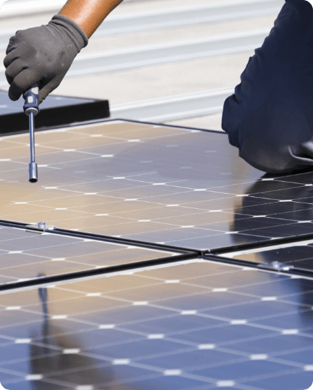 Man screwing in solar panels